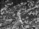Action Shot of Chicago Cub's Ernie Banks  Following Direction of Baseball Resulting from His Hit
