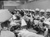 Women under Hair Dryers Getting Hair Styled in Beauty Salon at Saks Fifth Ave Department Store