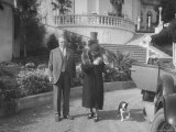 William Randolph Hearst and Mrs Burton Holmes at San Simeon Estate with Boston Bull Terrier
