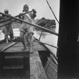 Yangtze River Essay: Rowers Straining at Oars Stroke Their Junk Through Rapids of the Yangtze River