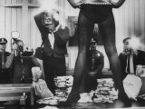 Actress Angie Dickinson's Lower Half Straddling a Million Dollars in Fake Money