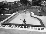 Liberace at the 'Piano' Shaped Pool in His Home