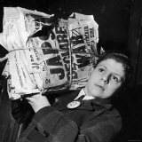 Boy from the Madison Square Boys' Club Carrying a Bundle of Newspapers After Attack on Pearl Harbor