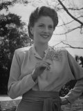 Actress Joan Fontaine Wearing Film Makeup and a Pompadour Hairdo  Relaxing in Garden at Home