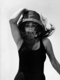 Actress Sophia Loren Yelling as She Hangs Onto Her Hat While Fighting on a Speed Boat