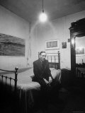 Author William Burroughs  an Ex Dope Addict  Relaxing on a Shabby Bed in a "Beat Hotel"
