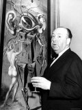 Film Director Alfred Hitchcock  Standing Beside Salvador Dali's Painting "Movies"