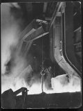 Female Metallurgist Peering Through an Optical Pyrometer to Determine the Temperature of Steel