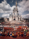 Walt Disney Characters and Park Staff Posing En Masse in Front of Cinderella's Castle