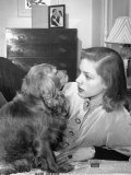 Actress Lauren Bacall Chatting with Her Cocker Spaniel Dog in Her Suite at Gotham Hotel