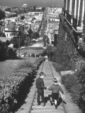 Two Boys Walking Hand in Hand Down Long Stairway with view of Bay from Pacific Heights