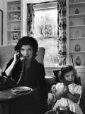 Jackie Kennedy  Wife of Senator John Kennedy  Talking on the Telephone as her daughter mimics her