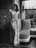 Actress Rita Hayworth Clad in Bare Midriff Evening Gown by Designer Jean Louis
