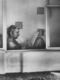 Poet Rod McKuen Writing Song Lyrics in His Bathtub  at Home