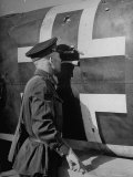 Russian Soldier Peering Through Hole in Fuselage of German Dive Bomber During Air Raid on the City