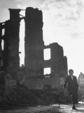 Boy Whose Left Leg Was Crushed in an Air Raid  Walking Down the Streets of the Ruined City
