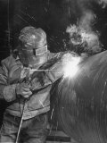 Worker Welding Pipe Used in Natural Gas Pipeline at World's Biggest Coal Fueled Generating Plant