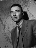 Physicist Dr J Robert Oppenheimer  Standing in Front of a Map at the New War Dep't Building