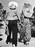 Model Stephanie Nikashian in Cartwheel Straw Hat and Flower Print Turkish Trousers