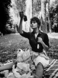 Actress Sophia Loren Examining Contents of Bottle During Location Filming of "Madame Sans Gene"