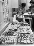 Cornell's Home Economics Student Lois Schumacher prepares food  Classmates Help with Decorations