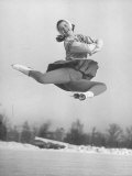 Barbara Ann Scott Smiling as She Leaps in Air on Skates at World Figure Skating Championship