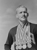 Swimmer Don Schollander Posing with 4 Gold Medals He Won in the Summer Olympics