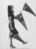 Writer Gloria Steinem Carrying Banners for Professional Football Teams