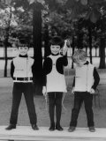 Three Little Kids in the Park While Modeling Their Black and While Pierre Cardin Outfits