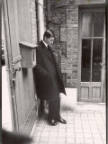 Christian Dior's Successor Yves Saint Laurent Standing Alone After Attending Dior's Funeral