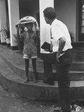 Evangelist Billy Graham Talking to a Boy with a Fish on His Head