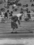Russian Woman Preparing the Surface of the Track Sodden before Khrushev Stadium foot races