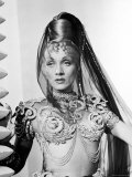 Marlene Dietrich Sporting Exotic Hairdo and Skin Revealing Chiffon Harem Costume