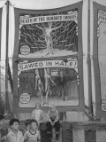 Children Sitting in Front of Banners for Magic Show Being Performed by Orson Welles
