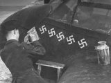 British RAF Beaufighter Pilot Stenciling Additional Swastika on Aircraft