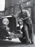 Richard Todd Leaning on Front of Car