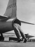 Mechanic Climbing Into Tailpipe to Check Clearance Between Turbine Wheel Bucket Tips and rug