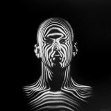 Man with Patterns of Light Covering Face and Shoulders in Air Force Study in Making Flight Helmets