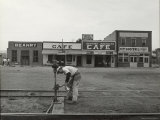 Pacific Railroad Brakeman in Front of SP Hotel and 3 Hash Houses