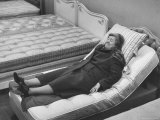 Woman Resting After a Long Siege of Bed Testing in the Bed Department at Lewis and Conger Store