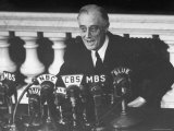 President Franklin D Roosevelt Sitting in Front of a Network Radio Microphones