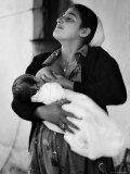 Kurdi Mother  One of the Most Primitive Tribes of Israel  Nursing Child in Mountain Colony