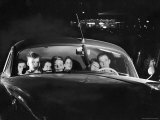Carload of Happy Movie Fans Incl Parents with Their Kids Who Get in Free