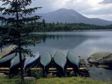 Canoes Turned Bottom Side Up on Shore of Unidentified Lake in Maine