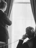Pres John F Kennedy on Telephone While Brother  Attorney General Robert F Kennedy Stands Nearby