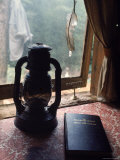 Lantern and Menorah on Table Next to Bk Aquarian Gospel of Jesus the Christ