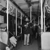 Activist Folk Musician Woody Guthrie Playing for a Subway Car of New Yorkers
