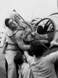 Crewman Lifting Injured Airman Kenneth Bratton Out of Turret of Tbf Aircraft on USS Saratoga