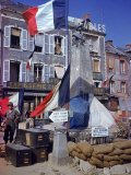 American Soldiers Standing Next to World War I Monument Bedecked with French Flags