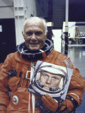 Astronaut John Glenn in Pressure Suit for Flight Into Space Holding Photo of Himself